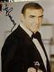 An 8 x 10 color publicity photo sign by Sean Connery from a James Bond film